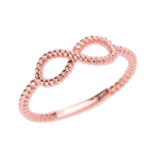 Load image into Gallery viewer, Twisted Rope Band Infinity Ring in Gold - solid gold, solid gold jewelry, handmade solid gold jewelry, handmade jewelry, handmade designer jewelry, solid gold handmade designer jewelry, chic jewelry, trendy jewelry, trending jewelry, jewelry that&#39;s trending, handmade chic jewelry, handmade trendy jewelry, mod-chic jewelry, handmade mod-chic jewelry, designer jewelry, chic designer jewelry, handmade designer, affordable jewelry